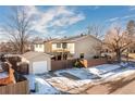 Aerial view showing house, detached garage, and backyard at 4700 S Decatur St, Englewood, CO 80110