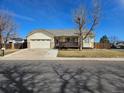 Charming single-Gathering home with attached two car garage and a wooden deck at 808 Idalia St, Aurora, CO 80011
