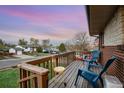 View from porch with cozy chairs and lovely sunset at 11398 W Ford Pl, Lakewood, CO 80226