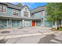 View of townhomes with attached garages and parking at 680 S Main St # 19, Breckenridge, CO 80424