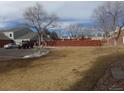 A well maintained community grassy area is adjacent to the parking area and other townhome units at 7474 E Arkansas Ave # 18-12, Denver, CO 80231