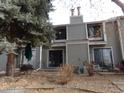Townhome's backyard featuring a patio with outdoor furniture, and a well maintained grassy landscape at 7474 E Arkansas Ave # 18-12, Denver, CO 80231