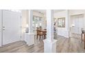 Formal dining area with hardwood floors and view into kitchen at 11261 W Quincy Pl, Littleton, CO 80127