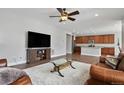 Inviting living room with hardwood floors, open layout, seamlessly connects to the kitchen and dining area at 3980 Trail Stone Cir, Castle Rock, CO 80108
