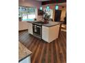 Lovely kitchen showcasing an island with cooktop and white cabinetry at 21221 Colorado 103, Idaho Springs, CO 80452