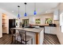 Kitchen featuring island with countertop seating and modern appliances at 21221 Colorado 103, Idaho Springs, CO 80452
