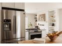 Modern kitchen featuring stainless steel appliances, a gas range, and stylish finishes at 5700 E Floyd Ave, Denver, CO 80222