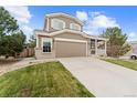 Inviting two-story home with a two-car garage and well-manicured lawn at 1232 Berganot Trl, Castle Pines, CO 80108