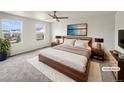 Comfortable bedroom with soft lighting, plush rug, and modern furnishings at 4670 Quandary Peak St, Brighton, CO 80601