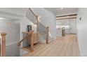 Light hallway with staircase, leading to an open kitchen at 1655 S Marion, Denver, CO 80210