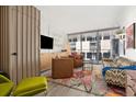 Bright living room with comfortable seating, unique decor, and large windows at 790 N Washington St # 407, Denver, CO 80203