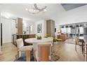Stylish open-concept living space with modern decor, wood floors, and large windows at 790 N Washington St # 407, Denver, CO 80203
