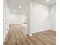 Spacious basement featuring recessed lighting, and wood-look floors, offering flexibility for various uses at 22435 E 7Th Pl, Aurora, CO 80018