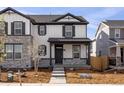Charming two-story home featuring stone accents, and a well-maintained front yard, perfect for curb appeal at 22435 E 7Th Pl, Aurora, CO 80018