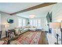 Comfortable living area with fireplace and large windows at 7340 W 32Nd Ave, Wheat Ridge, CO 80033