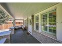 Inviting front porch with seating area and natural light at 7340 W 32Nd Ave, Wheat Ridge, CO 80033