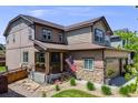 Charming two-story home with stone accents, covered porch, and three car garage at 7514 Blue Water Dr, Castle Rock, CO 80108