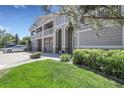 Beautifully landscaped townhouse with a well-maintained lawn and mature trees at 4251 S Blackhawk Cir # 3E, Aurora, CO 80014