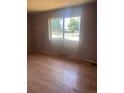 Bedroom featuring laminate floors and a large window to let in natural light at 606 Tennyson St, Denver, CO 80204