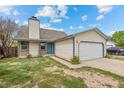 Quaint single-Gathering home with a two-car garage and a beautifully landscaped front yard at 8603 Barberry Pl, Parker, CO 80134