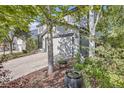 Well-maintained two-story home with a two-car garage, a long driveway, and nice landscaping at 5316 S Rome St, Aurora, CO 80015