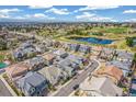 Gorgeous aerial view of a neighborhood with a pond, green spaces, and well-manicured lawns at 5943 S Olive Cir, Centennial, CO 80111