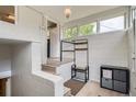 Bright entrance featuring white brick walls, a coat rack, and convenient storage space at 3655 Zenobia St, Denver, CO 80212