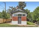 Charming brick home featuring unique architecture, with the house number prominently displayed above the entrance at 3655 Zenobia St, Denver, CO 80212