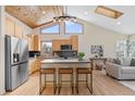 Contemporary kitchen featuring stainless appliances and a breakfast bar with seating at 342 Brook Cir, Boulder, CO 80302