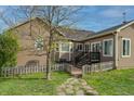 Charming backyard featuring a stone path, fenced-in yard, and access to the home's exterior at 2501 Remington Rd, Elizabeth, CO 80107
