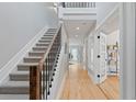 Well-lit hallway with hardwood floors, staircase, and contemporary design elements at 434 Clayton St, Denver, CO 80206