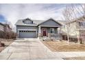 Charming single-Gathering home with a well-manicured front yard and attached two-car garage at 6495 S Harvest St, Aurora, CO 80016
