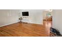Spacious living room with hardwood floors, perfect for entertaining guests or relaxing with Gathering at 8250 Chase Way, Arvada, CO 80003