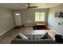 Comfortable living room with tile floors, neutral colors, and lots of light at 1237 Tamarac St, Denver, CO 80220