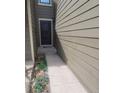 Exterior shot highlighting the front door, walkway, and landscaped entrance at 10806 W Evans Ave # 5, Lakewood, CO 80227