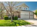 Well-maintained home with a three-car garage, landscaped front yard, and beautiful curb appeal at 7506 Chipmunk Pl, Littleton, CO 80125
