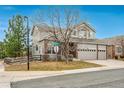 Well-maintained two-story home with a three-car garage and a charming fence at 7506 Chipmunk Pl, Littleton, CO 80125