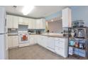Functional kitchen layout with ample counter space, abundant cabinets, and modern fixtures at 9369 Longs Peak Dr, Henderson, CO 80640