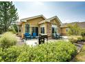 Cozy outdoor patio with grill, comfortable seating, and manicured landscaping for relaxing or entertaining at 22405 E Plymouth Cir, Aurora, CO 80016