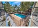 The beautiful community pool is surrounded by mature trees and offers a refreshing place to relax at 33 N Corona St # 205, Denver, CO 80218