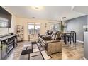 Inviting living room featuring hardwood floors, neutral tones, and a comfortable seating arrangement at 18865 E 57Th Ave # B, Denver, CO 80249