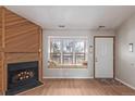 Cozy living room with inviting fireplace, a sunny window seat and natural light at 7683 S Steele St, Centennial, CO 80122