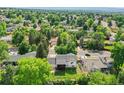 Expansive aerial view of a residential neighborhood showcasing tree-lined streets and well-maintained homes at 13246 Deneb Dr, Lone Tree, CO 80124