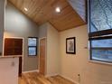 Inviting entryway featuring wood accents, hardwood floors, and plenty of natural light at 26212 Center Dr, Kittredge, CO 80457