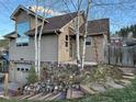 Attractive home with a stone foundation and a convenient garage at 26212 Center Dr, Kittredge, CO 80457