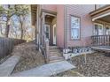 Inviting entrance featuring wooden steps and a decorative glass front door at 820 Kimbark St # B, Longmont, CO 80501