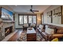 Living room with fireplace, large windows, and comfortable seating at 600 Columbine Rd # 5207, Breckenridge, CO 80424