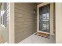Close-up of a home's front door with a screen and welcome mat at 19210 E Pacific Pl, Aurora, CO 80013