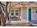 Inviting covered front porch featuring dining table with seating, perfect for enjoying the outdoors at 2362 Xanthia Way, Denver, CO 80238