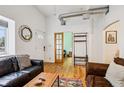 Inviting living room with hardwood floors, comfortable seating, and natural light at 915 26Th St, Denver, CO 80205
